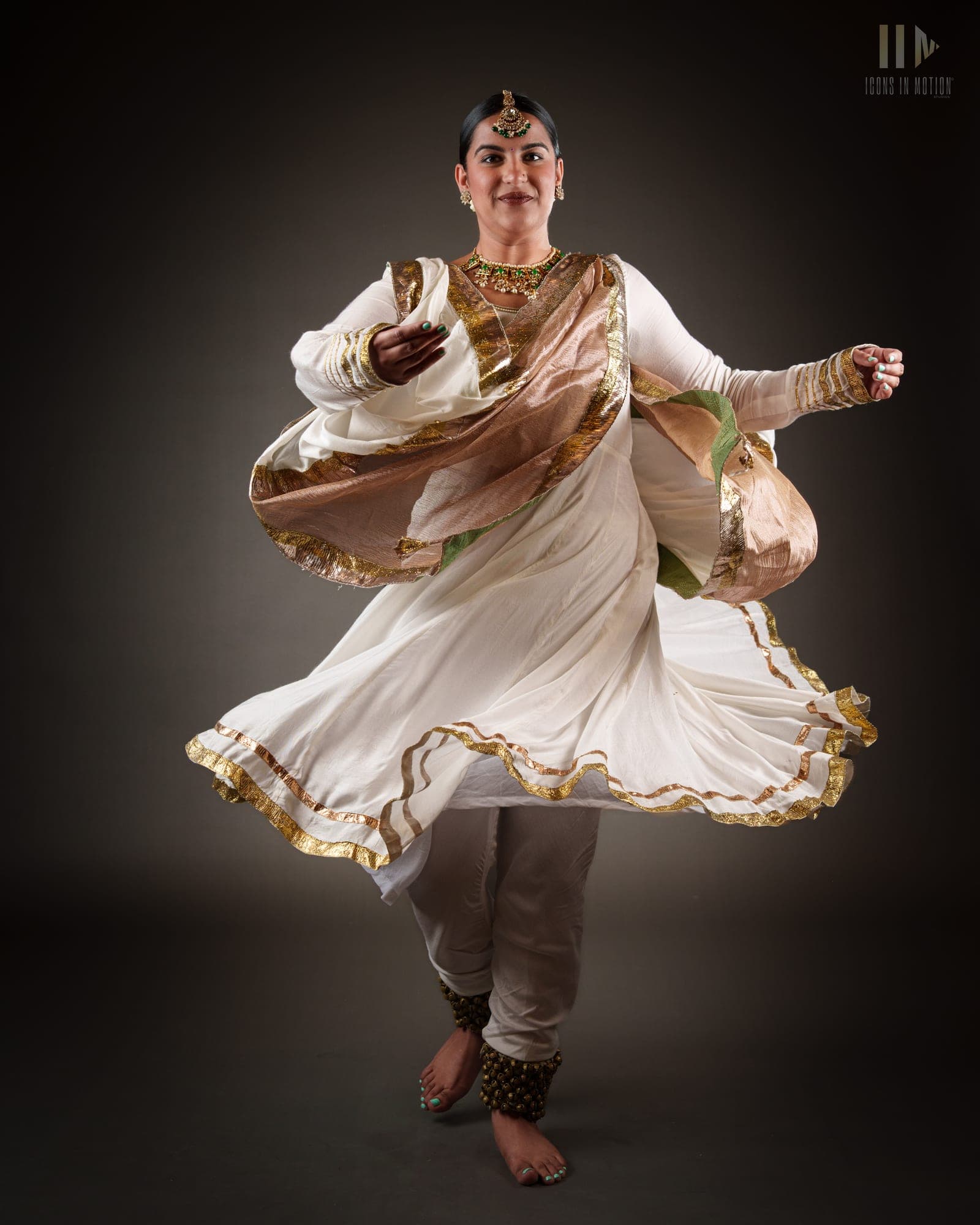 Classical dancer mid-spin, white skirt flaring around them